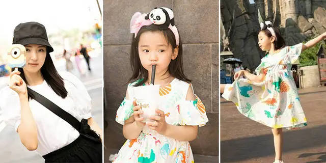 Dong xuanshai's daughter clocks in. Tourists take photos of five-year-old dimples and pours. Cute and cute