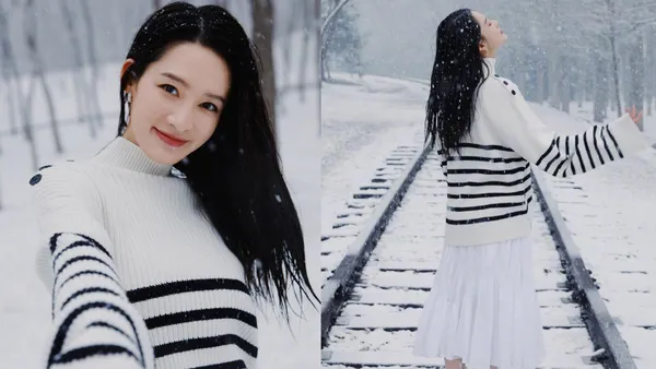 李沁晒春日雪地写真 飘落白雪点缀温柔笑靥氛围感拉满