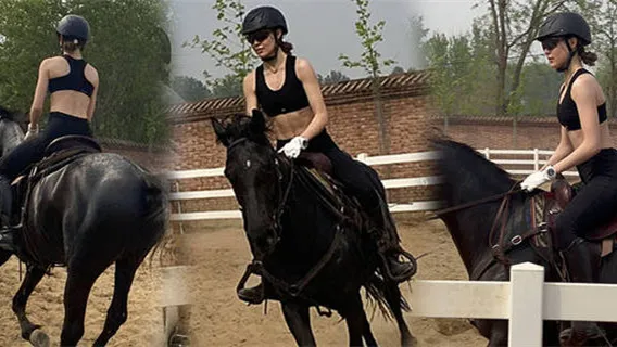 Gu ailing white shirt riding valiant, big show abdominal muscles super eye-catching