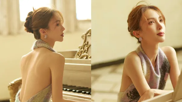 金晨身穿露背裙秀白皙美背 头发轻挽脑后温婉优雅