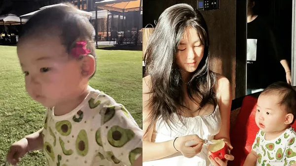 朱珠携女儿王珠宝外出游玩 低头为小朋友刮果泥温馨十足