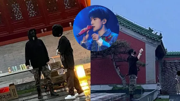 易烊千玺逛集市被偶遇 穿着黑色帽衫拍照打扮休闲低调