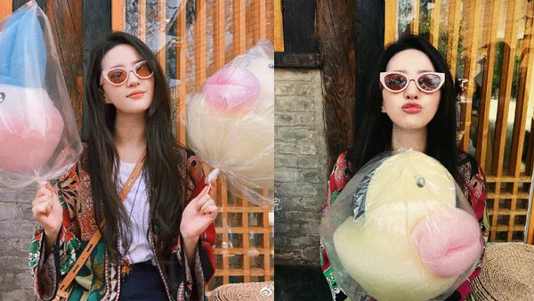 劉亦菲は日焼けしてマシュマロを持ってかわいい口をぶつぶつ言っています