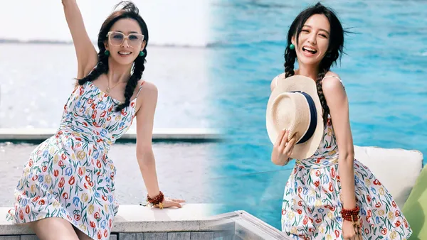 佟丽娅晒海边双麻花辫写真 穿碎花短裙嬉闹俏皮可爱