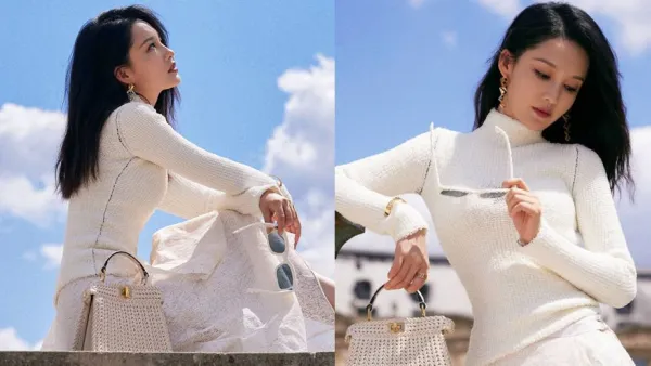 Li Qin is gentle and elegant in a white lace hollowed-out dress.