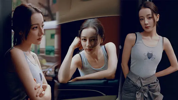 迪丽热巴穿可爱背心大秀锁骨 街头拍照长腿超吸睛