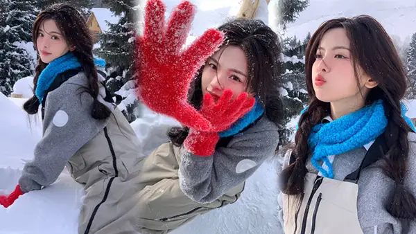 Yang surpasses the first snow to take photos cute and cute with red gloves and a pair of ponytails