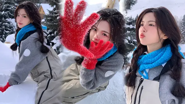 楊は初雪を超えて写真を撮るのがスマートでかわいい赤い手袋をつけてツインテールのしゃれた