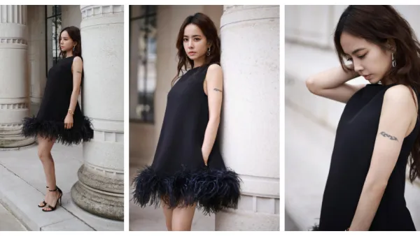 Jolin Tsai wears a black feather skirt full of wavy curls relaxed and elegant