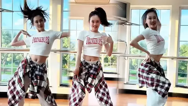 Miao Miao wears a ponytail and dances in a female group like a girl wears a sexy waist dress and is full of vitality