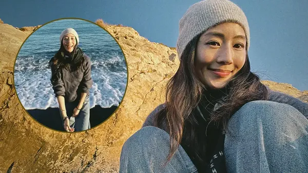 Zhang Junning basked on the beach and took a selfie while walking barefoot on the beach to relax