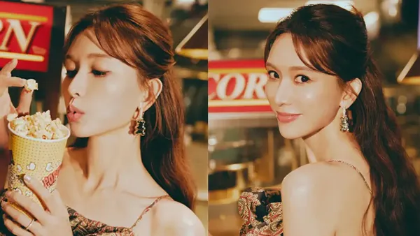 Lin Zhiling wears a long dress with a pattern suspender and has an elegant posture and holds popcorn with a gentle expression