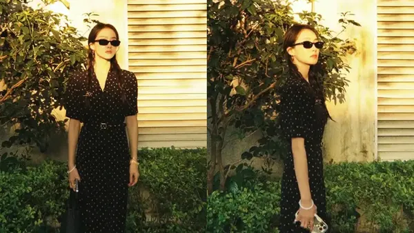 Song Qian wears a dotted floral dress, pure literature and art, standing freely and brightly in the sun