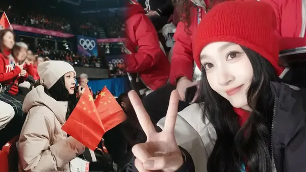 关晓彤穿厚实羽绒服戴冷帽松弛亮眼 双手合十观赛专注又投入